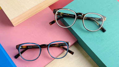 Two pairs of glasses on colorful blocks