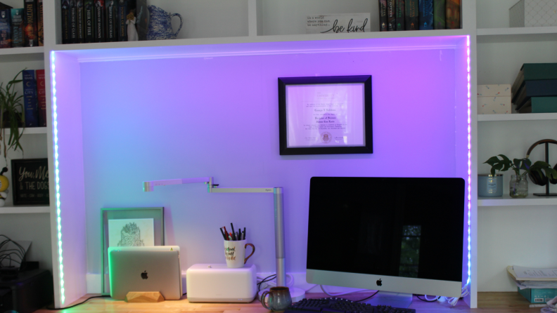 The Kasa Smart Light Strip Multicolor installed around a desk