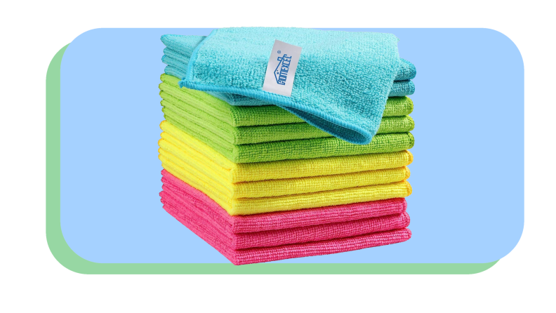 Pink, yellow, blue and green microfiber cloths folded into squares and stacked on top of each other.