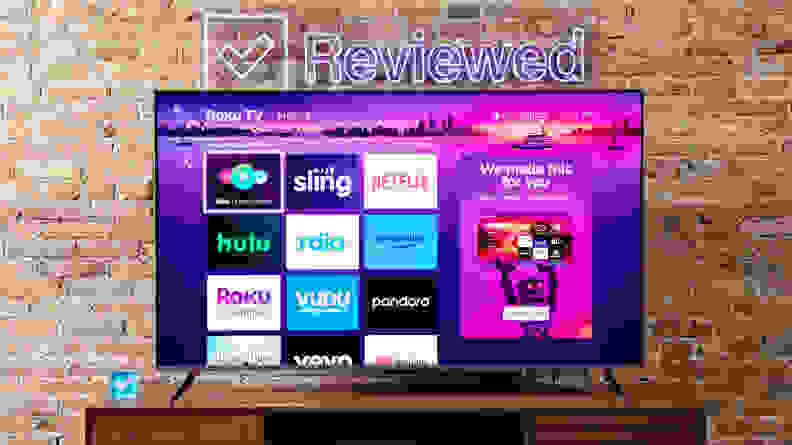 The Roku Plus Series QLED TV with the menu onscreen.