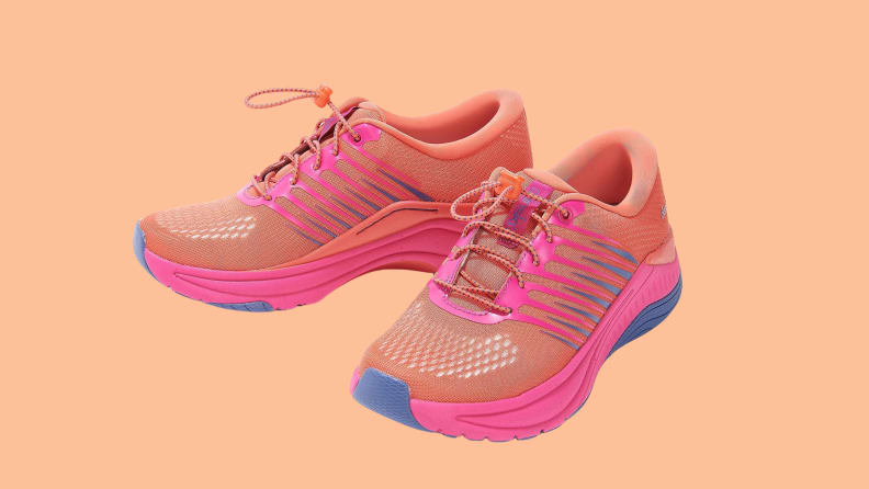 orange and hot pink athletic sneakers on orange background
