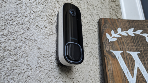 The Ecobee Smart Doorbell Camera hanging on the outside of a house.