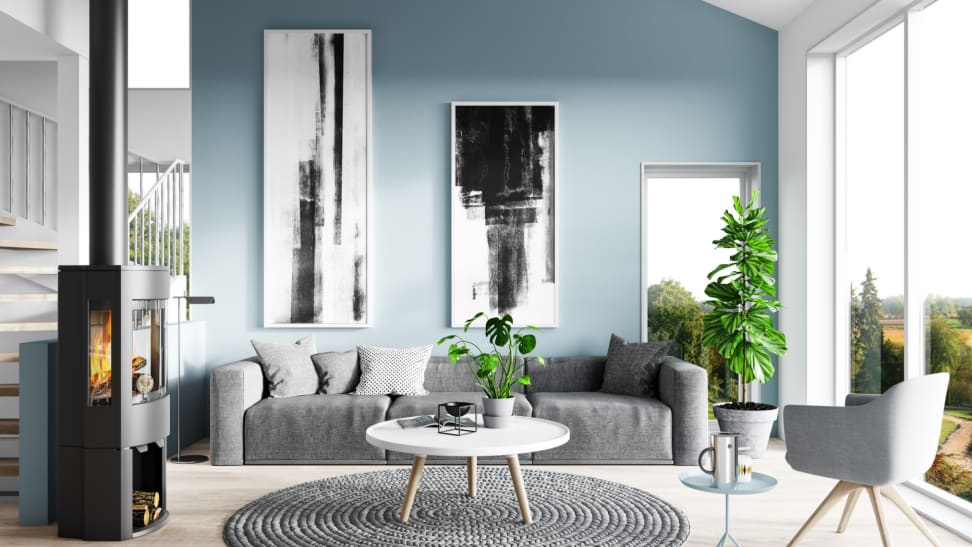 A modern living room with a light blue accent wall.