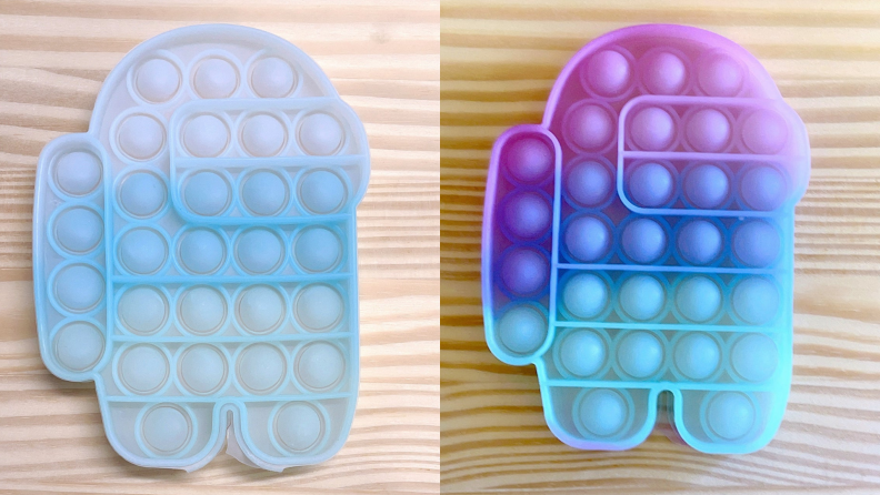 an Among Us imposter-shaped pop-it changes color in the sun