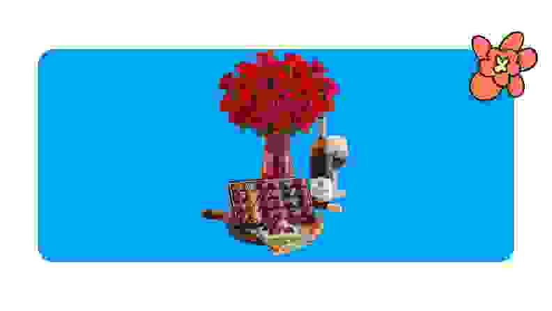 Vase of red roses, chocolates and a bottle of wine and a glass of red wine on a blue background