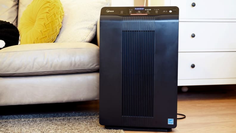 Black air purifier in living room