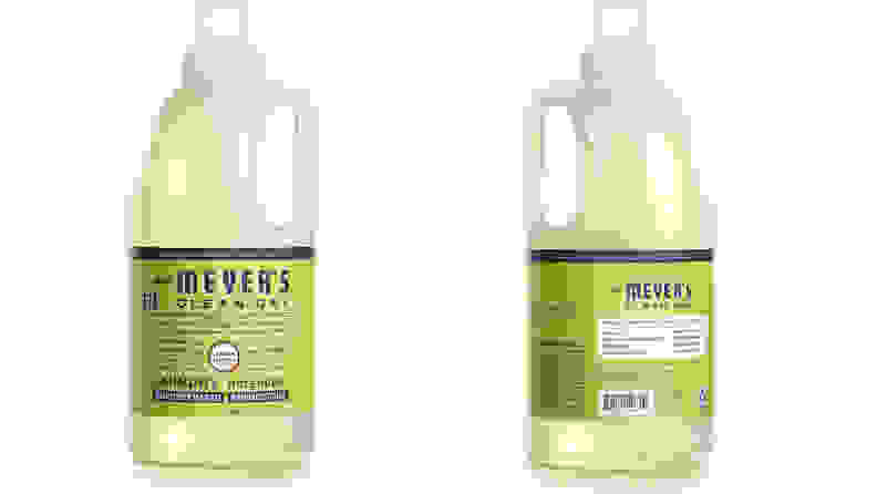 A bottle of Mrs. Meyer's laundry detergent shown from the front and the back on a white background.