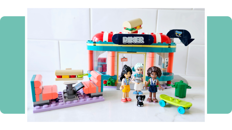 The Lego Friends HeartLake Downtown Diner on a green background.