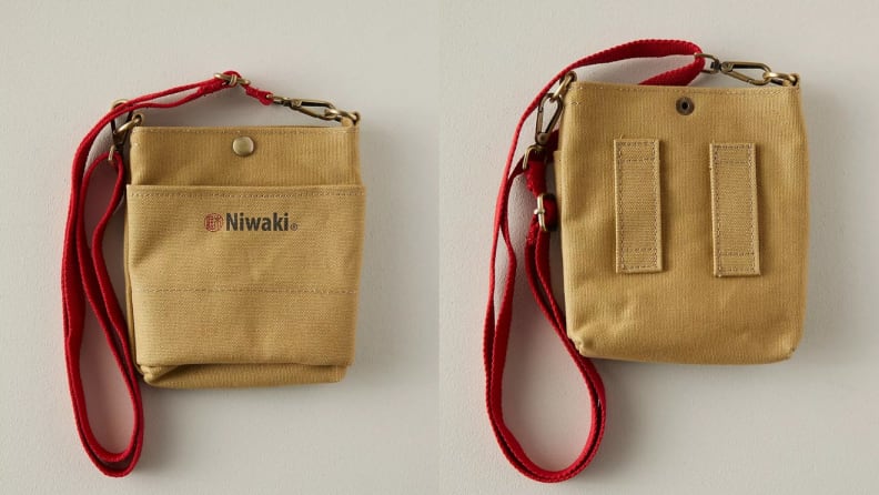 Canvas pouch with red lanyard attached.