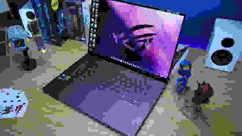 The Asus ROG Zephyrus G16 laptop sitting on a desktop.