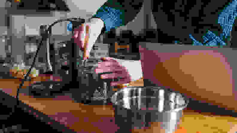 Making pesto with hand blender