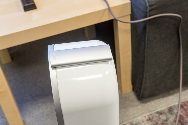 The remote adheres magnetically to the top of the unit.
