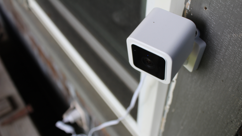 Wyze Cam V3 mounted on wall outdoors.