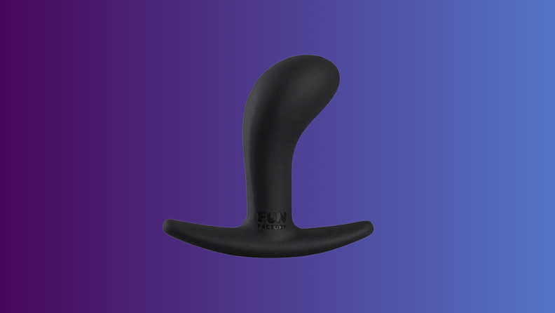 An anal sex toy sits on an indigo fade background