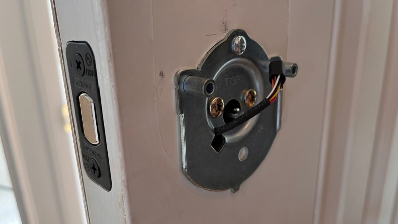 A door lock being installed on a door