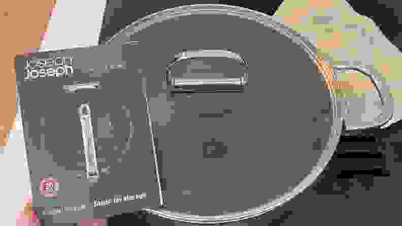 A close-up of a glass lid that goes to a 5-quart shallow casserole pan.