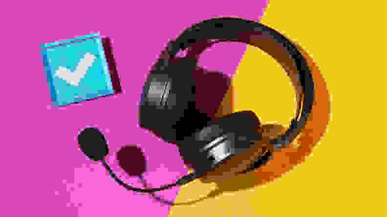 A heavy black headset on a purple and yellow background