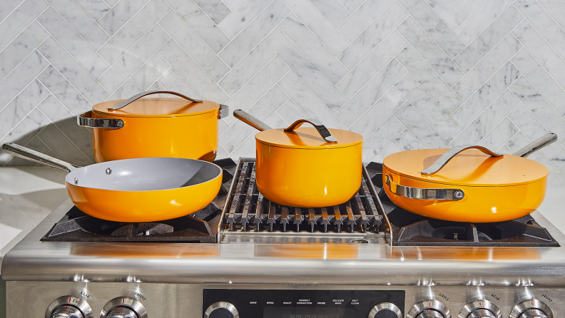 A set of yellow ceramic cookware.