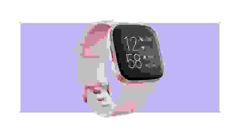 Fit bit with touch screen face and light pink band