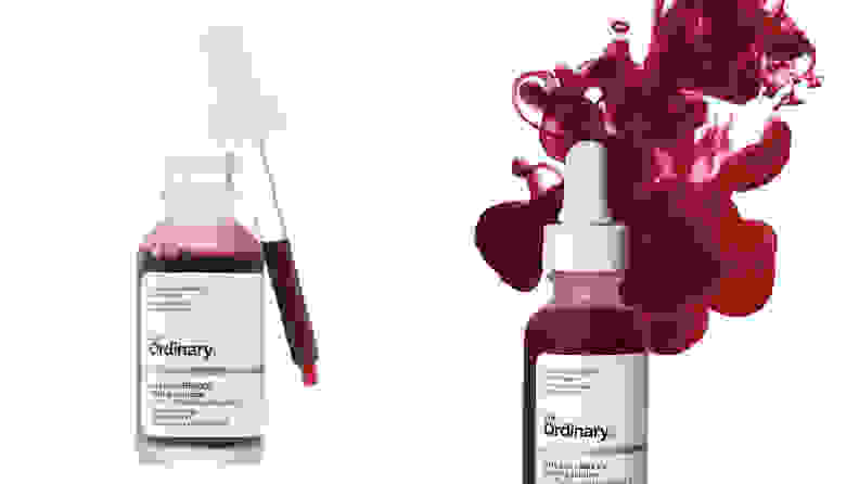 On the left: On a white background the The Ordinary AHA 30% + BHA 2% Peeling Solution is a clear bottle with a blood-red liquid inside it. The top of the container is open and a liquid dropped hangs to the side of the bottle with red liquid in it. On the right: The same bottle is shown but with red liquid suspended above it.