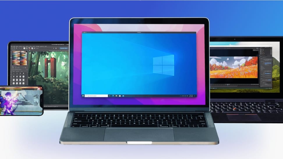 A Macbook displaying a Windows screen among other Apple devices.