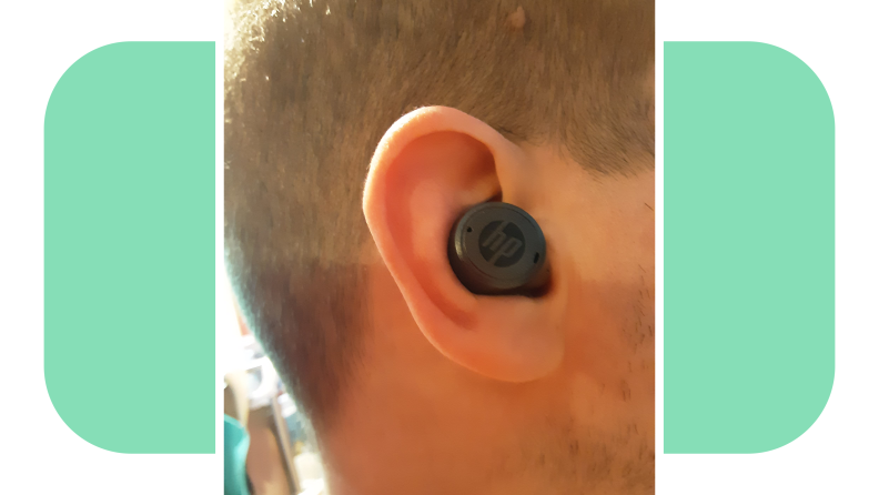Person wearing the HP Hearing Pro OTC hearing aid in ear canal.