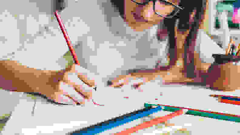 A photo of a woman coloring.