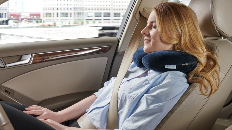 Woman using a neck pillow