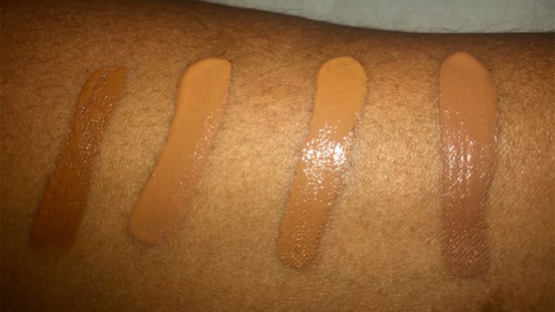 A panelist wearing swatches of the concealers on her arm.