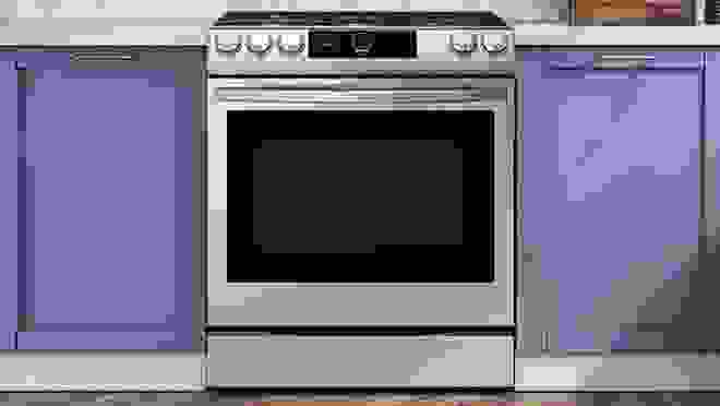 Stainless steel gas range in kitchen.