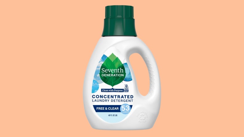 A bottle of Seventh Generation laundry detergent on a peach background