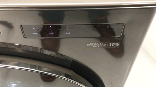 GIF of a close-up zoom on the control panel of the LG WM6700HBA front-load washing machine.