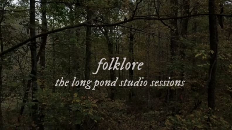 The title card for 'Folklore' featuring the title against a background of trees.