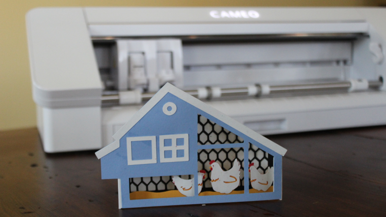 A chicken house cutout card.