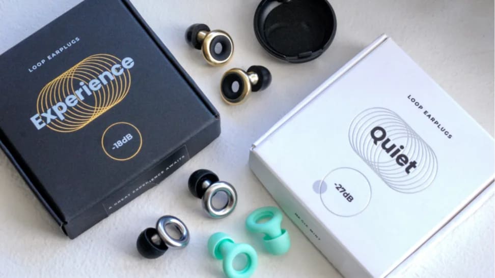 Loop earplugs in color(s) mint green, silver/black and gold/black next to black and white box packaging.
