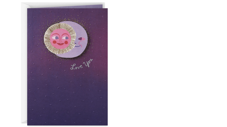 A purple greeting card depicts a smiling sun and crescent moon, back to back, nearly forming a perfect circle. Two words are printed beneath them in cursive: "Love you."