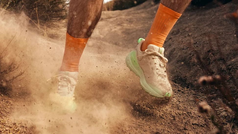 lululemon trail running sneaker on gravel background