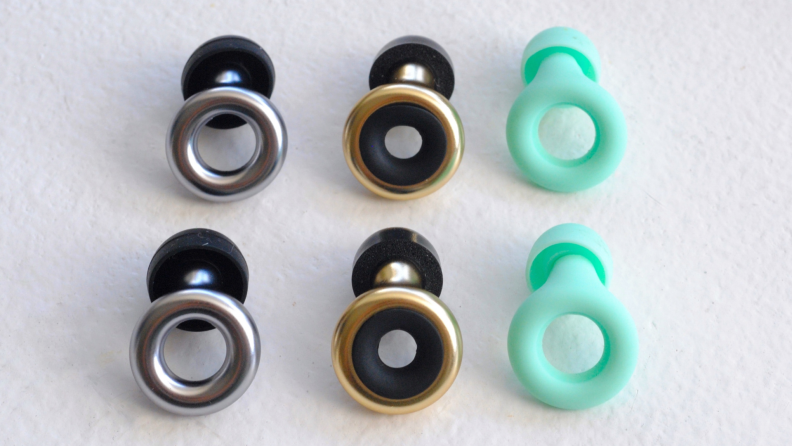 Loop earplugs in color(s) mint green, silver/black and gold/black.