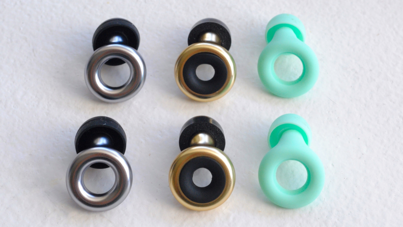 环形earplugs in color(s) mint green, silver/black and gold/black.