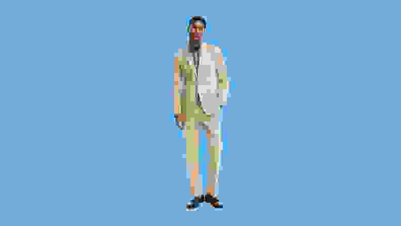 man in full cream suit