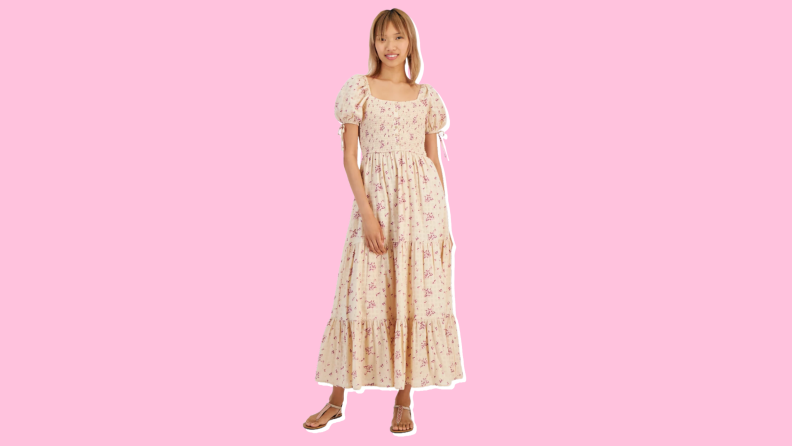 Photo of a woman wearing the And Now This Women's Cotton Scoop-Neck Puff-Sleeve Maxi Dress.