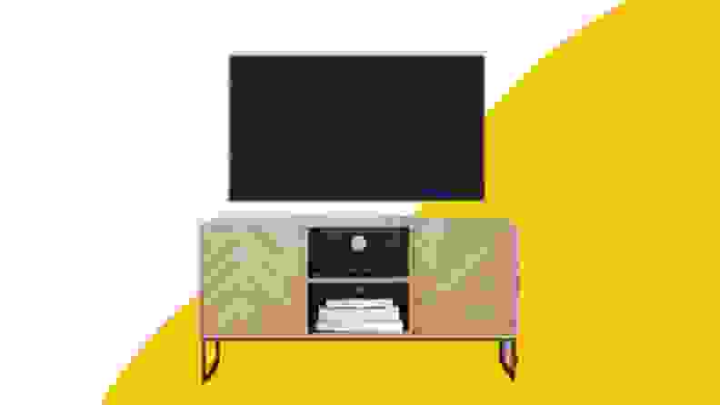 A wooden television console with television on top.