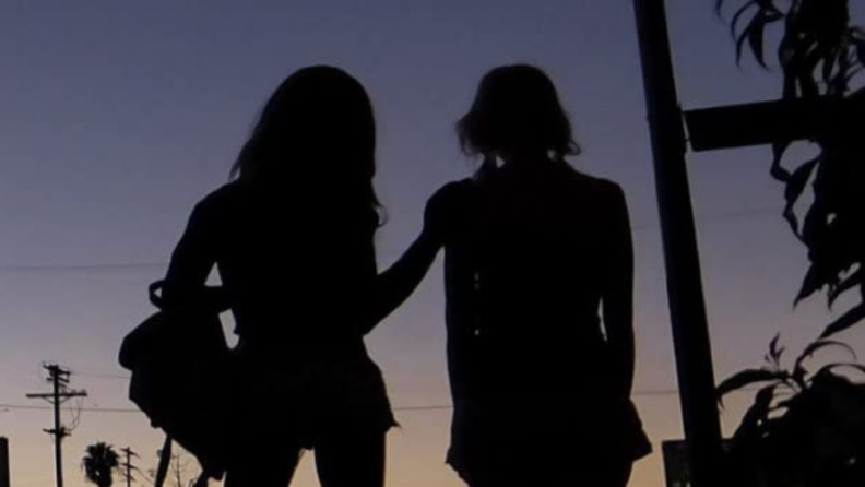 A still from the film _Tangerine_ featuring the two main characters silhouetted against a sunset.