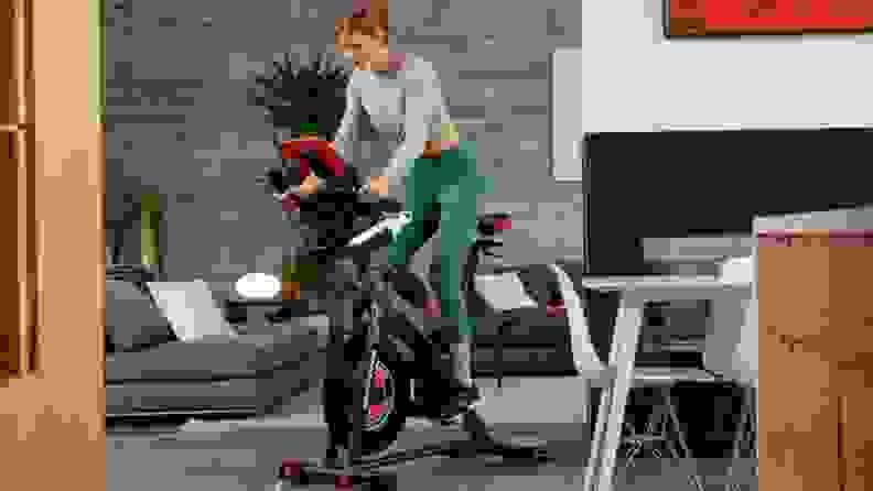 A person works out on an exercise bike.