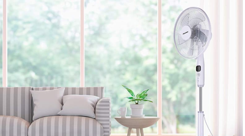 Pedestal fan by couch