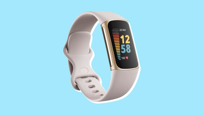 A white FitBit Charge 5 with the screen showing basic data.