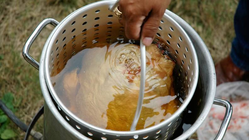 Turkey submerged in fry oil