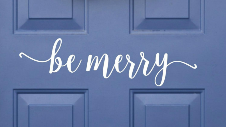 Vinyl decal of a sign that says 'Be Merry' on a blue door