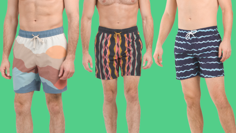 Three men's swimsuits: One with a landscape print, one with a multicolor print, and one with blue stripes.