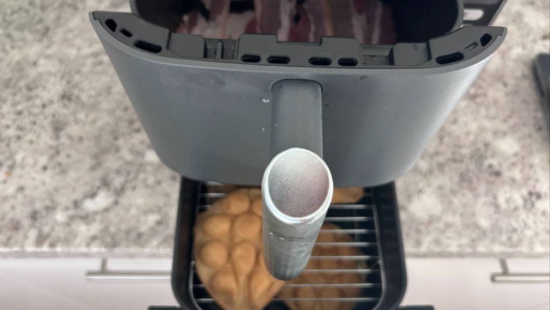 A closer view from above the Ninja Double Stack XL Air Fryer with food inside of both bins.